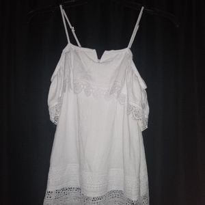 Spaghetti strap/off the shoulder white shirt.